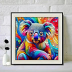 Colorful abstract koala painting in a white frame on a white brick wall background